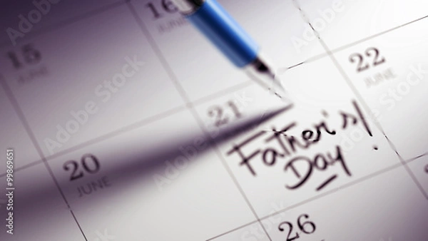 Fototapeta Closeup of a personal agenda setting an important date written w