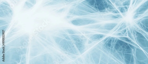 Fototapeta A close-up of delicate white cobwebs against a soft blue background, evoking a light and ethereal feel.