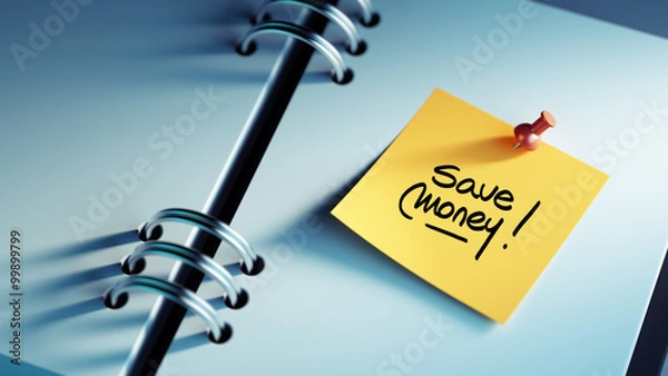 Fototapeta Closeup Yellow Sticky Note paste it in a notebook setting an app