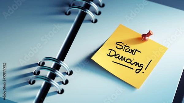 Fototapeta Closeup Yellow Sticky Note paste it in a notebook setting an app