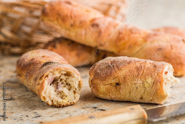 Obraz Crusty rustic baguette on kitchen table.