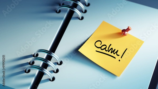 Obraz Closeup Yellow Sticky Note paste it in a notebook setting an app