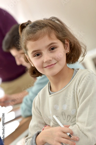 Obraz Portrait of smiling school girl in class