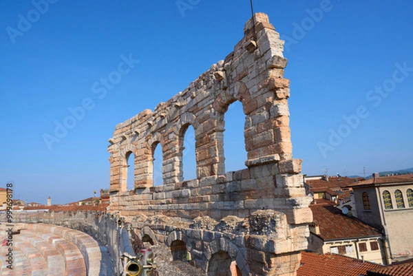 Fototapeta Arches and details of architecture of the famous ancient roman amphitheater Arena di Verona, Italy. The "Ala", the last surviving part of Arena outer ring. World Heritage site. Vacation in Verona.