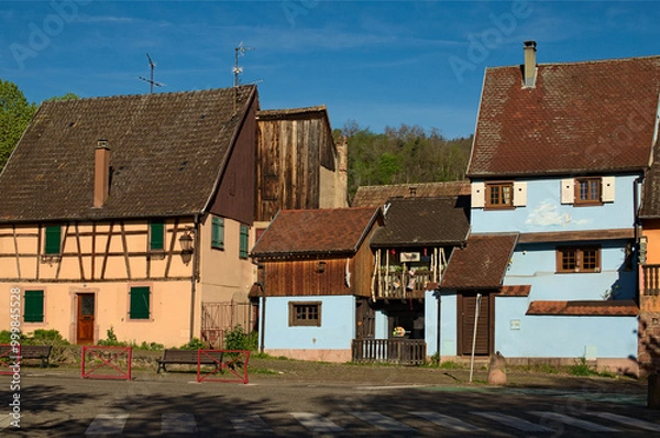 Fototapeta Picturesque landscape view of colorful ancient houses in Riquewihr village, France. The Riesling and other wines produced in this village. Famous touristic place and romantic travel destination