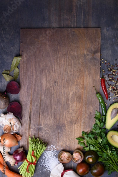 Obraz Healthy food background  on wooden board. Vegetable menu. Top view, copy space.