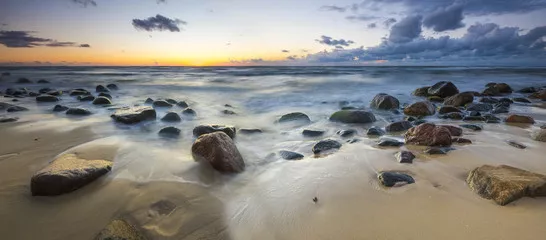 Fototapeta zachód słońca nad plażą morską