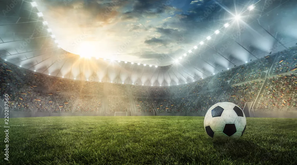 Fototapeta Piłka leży na trawie na stadionie piłkarskim