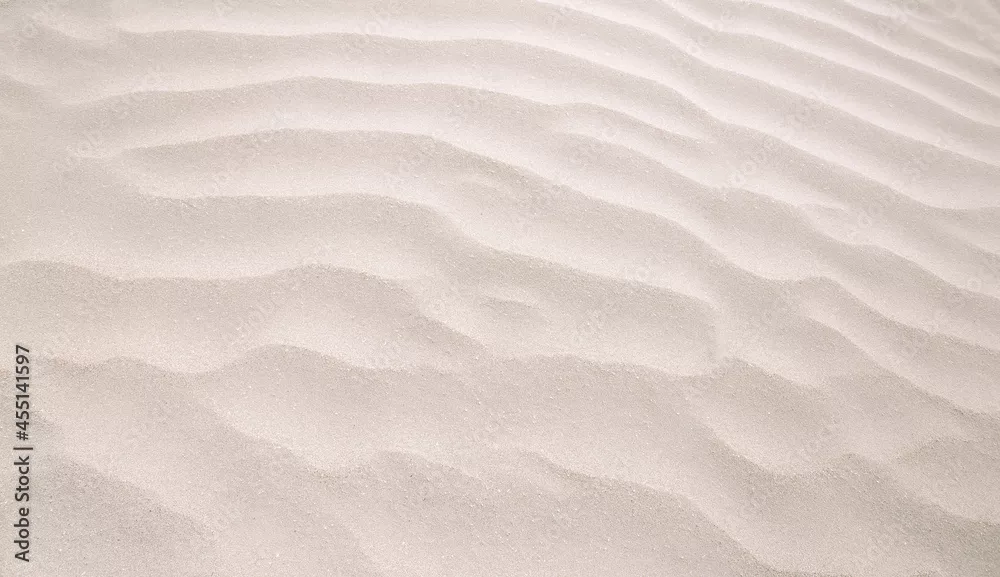 Fototapeta Streszczenie tło piaszczystego morza na plaży. Tekstura piasku falowego