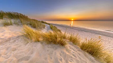 Obraz Magiczny Zachód Słońca nad Piaszczystą Plażą