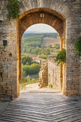 Fototapeta Wyjdź z miasta Monteriggioni z widokiem na toskański krajobraz
