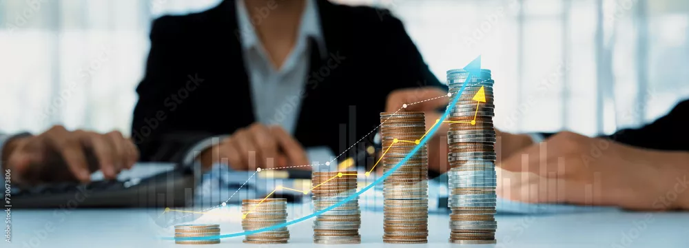 Fototapeta Stos monety z cyfrowym wskaźnikiem graficznym symbolizującym inwestycje biznesowe i wzrost gospodarczy. Biznesmen, który planuje planowanie finansowe, aby osiągnąć cel finansowy i przyczynić się do zysku. Sprytny