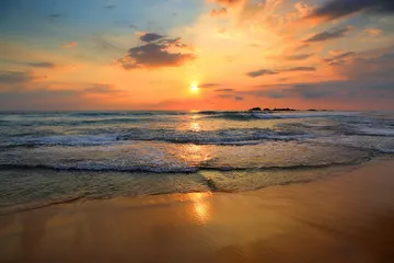 Fototapeta krajobraz z morzem zachód słońca na plaży