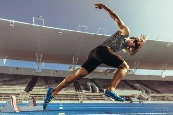 Fototapeta Sprinter Wybiegający Z Bloku Startowego - obrazek 2